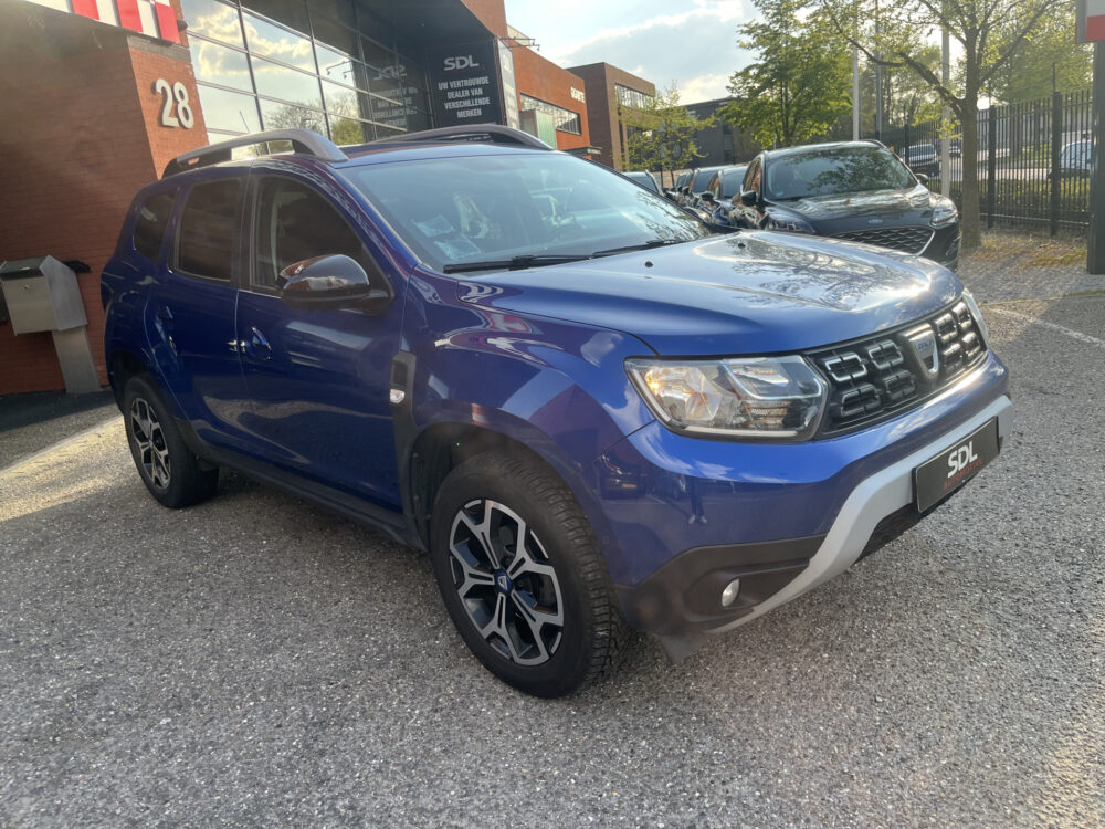 Dacia Duster 1.3 TCe Prestige // 360 CAMERA // DODEHOEK // CLIMA // CRUISE // NAVI+CARPLAY // 7