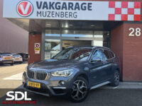 BMW X1 xDrive20i Executive // PANO / SCHUIF- KANTELDAK // NAVI // PDC V+A // CRUISE // TREKHAAK // ELEK. ACHTERKLEP // 33
