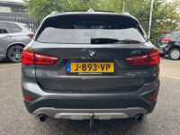 BMW X1 xDrive20i Executive // PANO / SCHUIF- KANTELDAK // NAVI // PDC V+A // CRUISE // TREKHAAK // ELEK. ACHTERKLEP // 39
